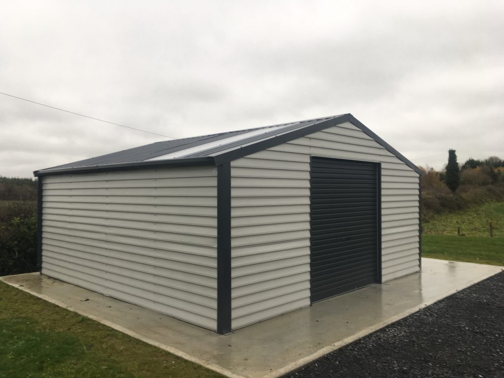 Garages grey in color in a yard Shouteast stell sheds